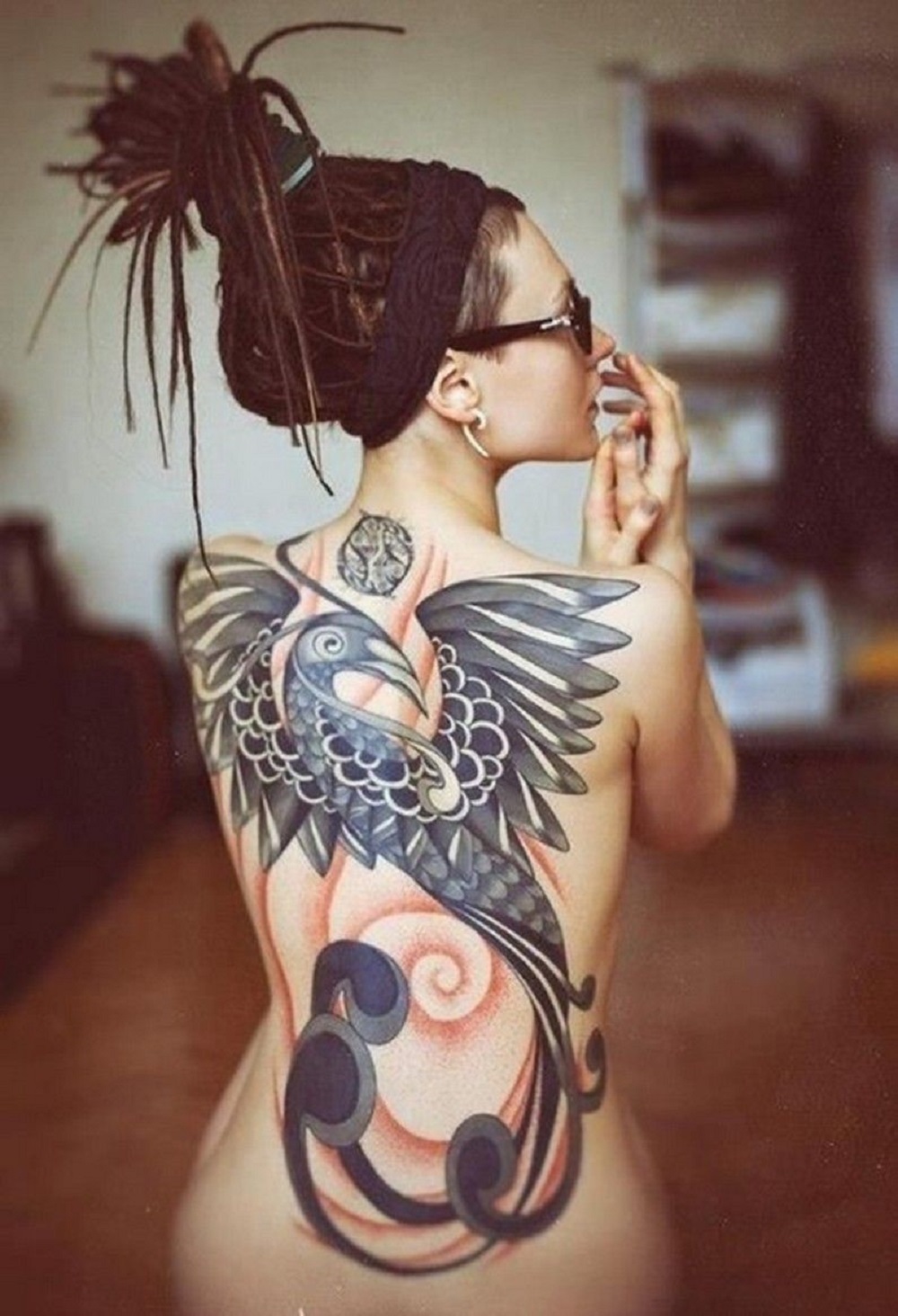 Tatuagem nas costas - pássaro