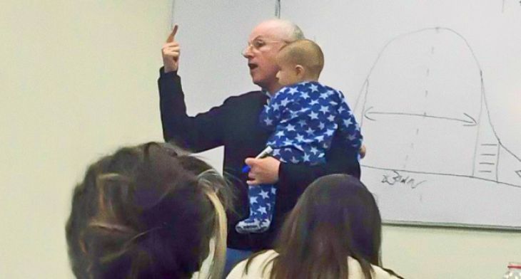 Professor with a baby in his arms